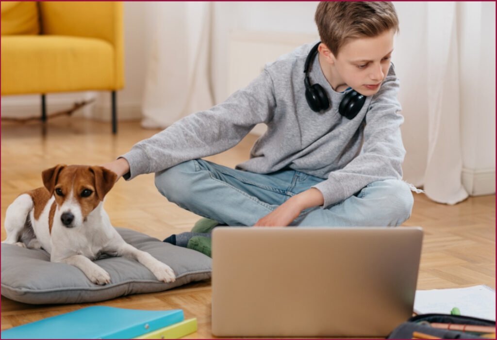 Homeschooled teen with his dog, ready to learn at Athena's Homeschool Academy - AHA!